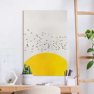 Leinwandbild - Vogelschwarm vor gelber Sonne - Hochformat 3:2
