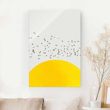 Glasbild - Vogelschwarm vor gelber Sonne - Hochformat 3:2
