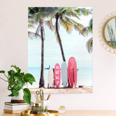 Glasbild - Rosa Surfboards unter Palmen - Hochformat