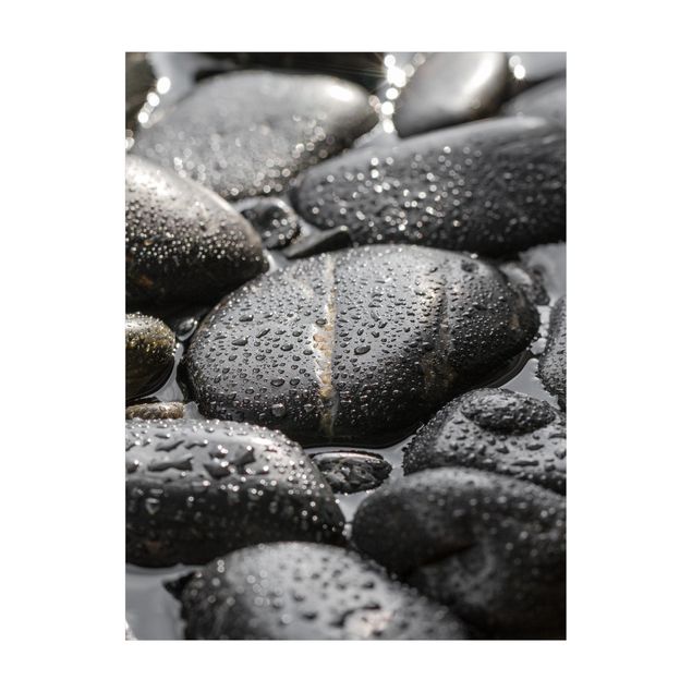 Wanddeko schwarz Schwarze Steine im Wasser