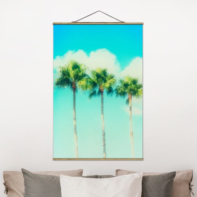 Wanddeko Wohnzimmer Palmen vor Himmel Blau