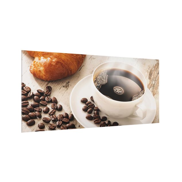 Wanddeko Kulinarisch Dampfende Kaffeetasse mit Kaffeebohnen