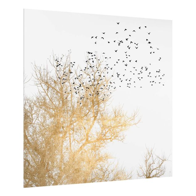 Wanddeko Bäume Vogelschwarm vor goldenem Baum