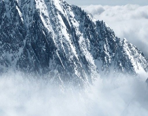 Waschbeckenunterschrank mit Motiv Die Alpen über den Wolken