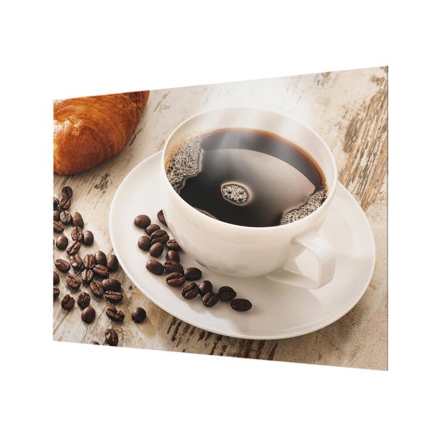 Wohndeko Fotografie Dampfende Kaffeetasse mit Kaffeebohnen