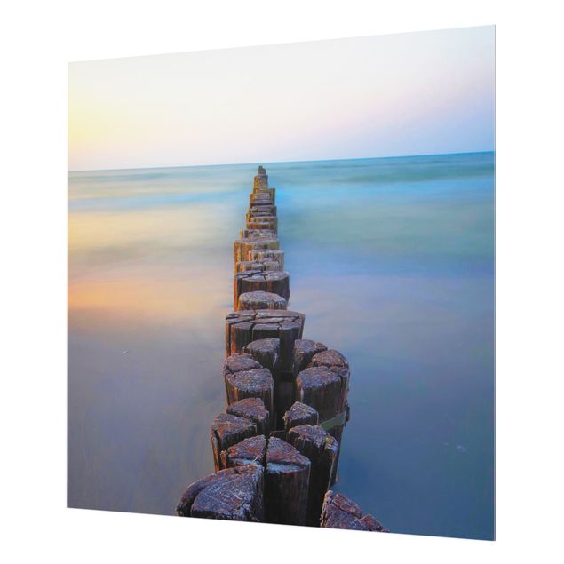 Wanddeko Fotografie Buhnen bei Sonnenuntergang am Meer