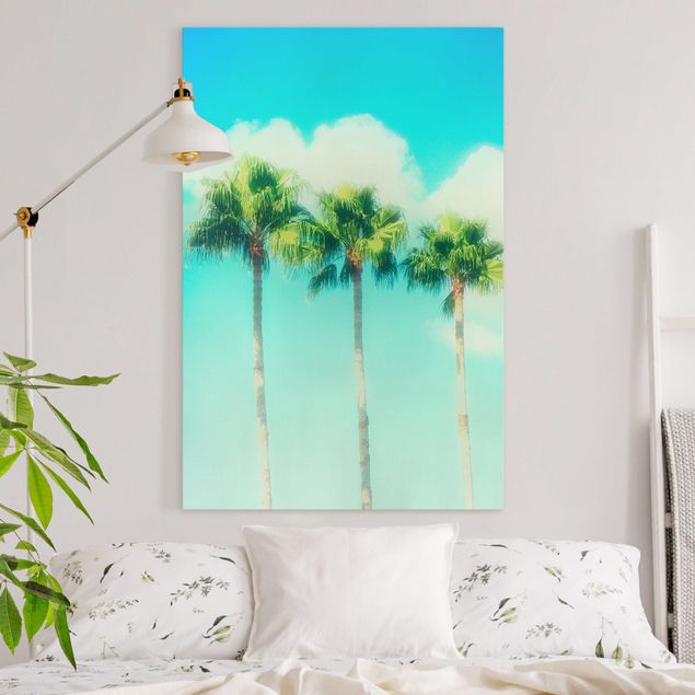 Wanddeko Wohnzimmer Palmen vor Himmel Blau