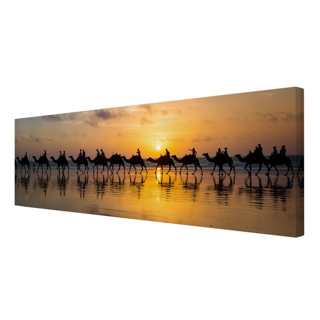 Wanddeko orange Kamele im Sonnenuntergang