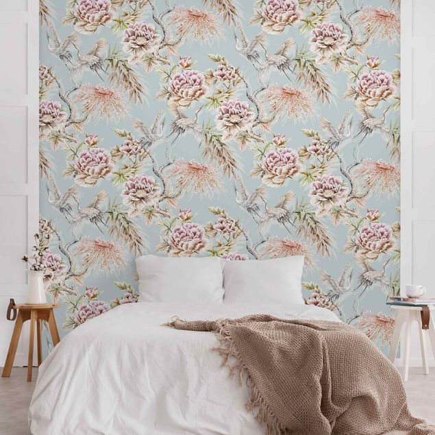 Wanddeko Wohnzimmer Aquarell Vögel mit großen Blüten vor Blau
