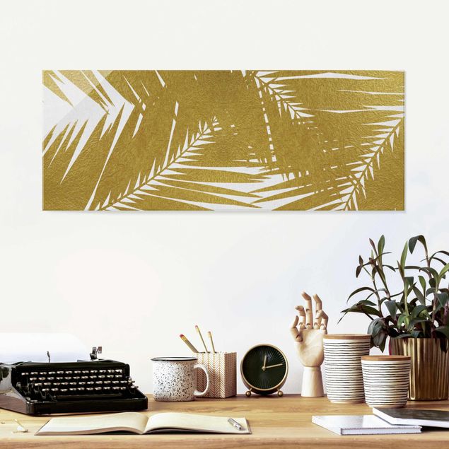 Wanddeko Schlafzimmer Blick durch goldene Palmenblätter