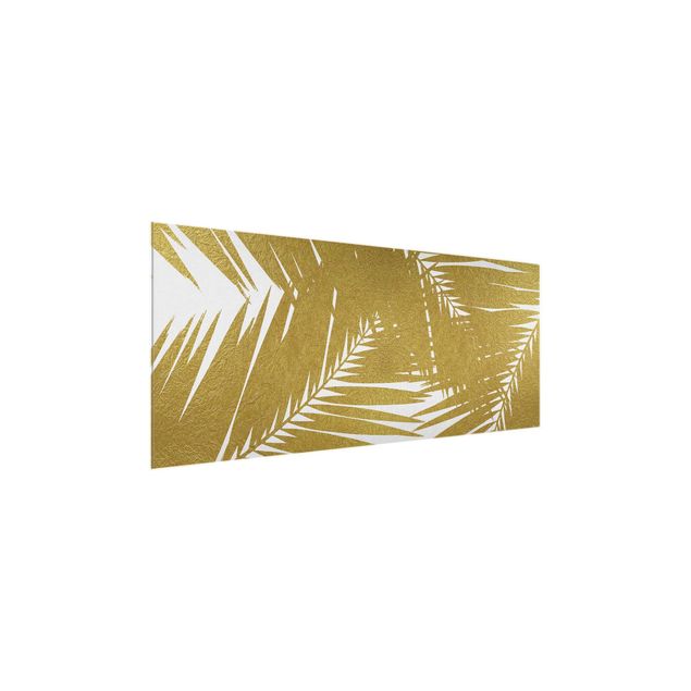 Wanddeko Esszimmer Blick durch goldene Palmenblätter