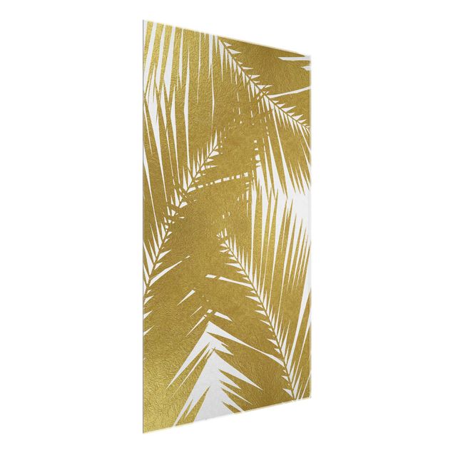 Wanddeko Esszimmer Blick durch goldene Palmenblätter