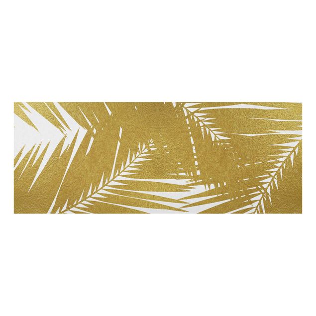 Wanddeko Büro Blick durch goldene Palmenblätter