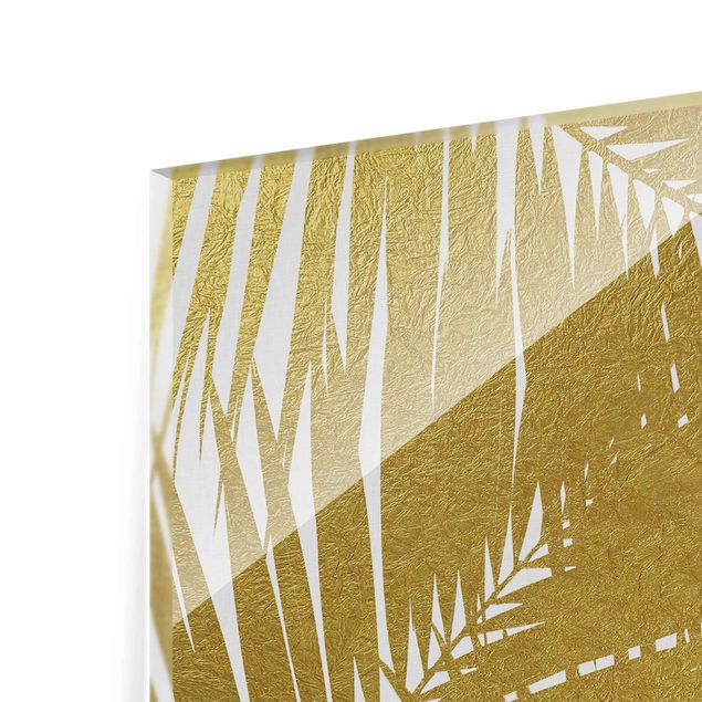 Wanddeko Treppenhaus Blick durch goldene Palmenblätter