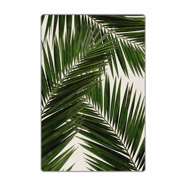 Wanddeko Praxis Blick durch grüne Palmenblätter