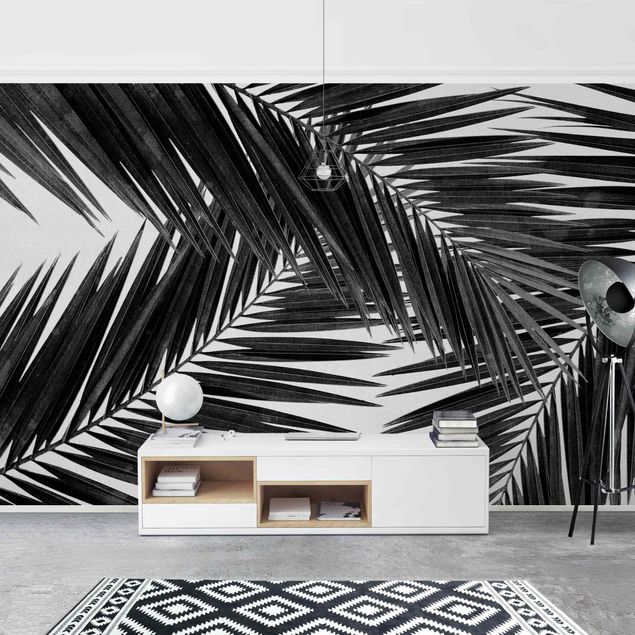 Wanddeko Wohnzimmer Blick durch Palmenblätter Schwarz-Weiß