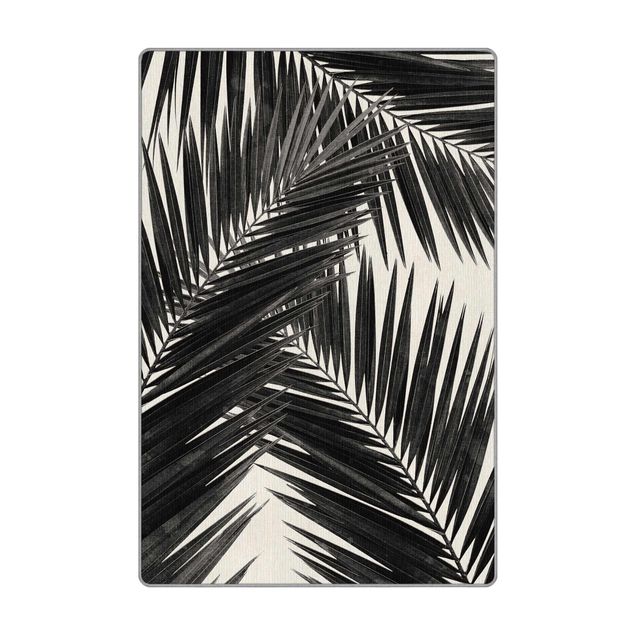 Wanddeko Praxis Blick durch Palmenblätter schwarz weiß