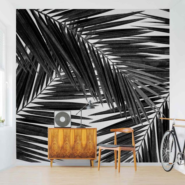 Wanddeko Wohnzimmer Blick durch Palmenblätter schwarz weiß