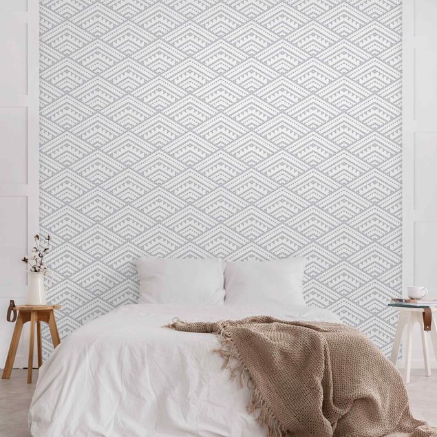 Wanddeko Wohnzimmer Muster aus kleinen Dreiecken in Grau