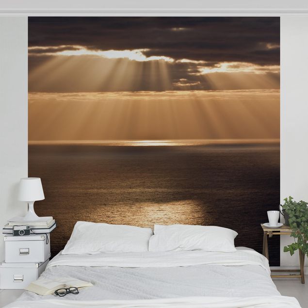 Wanddeko Wohnzimmer Sonnenstrahlen über dem Meer