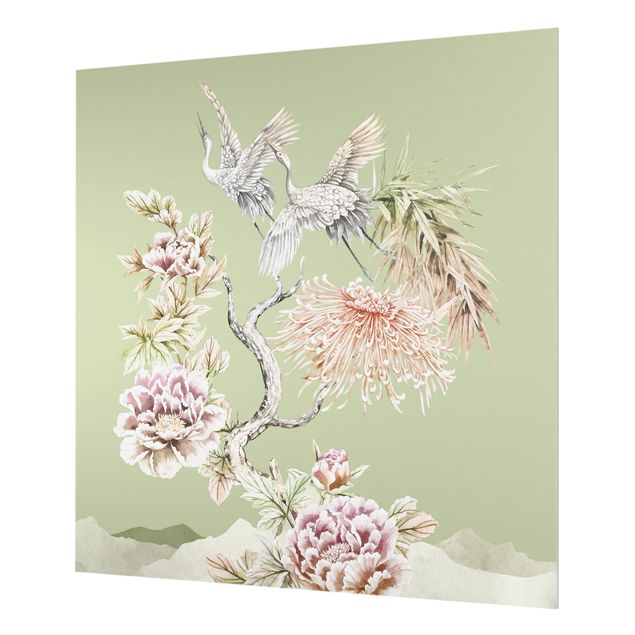 Deko Aquarell Aquarell Störche im Flug mit Blumen auf Grün