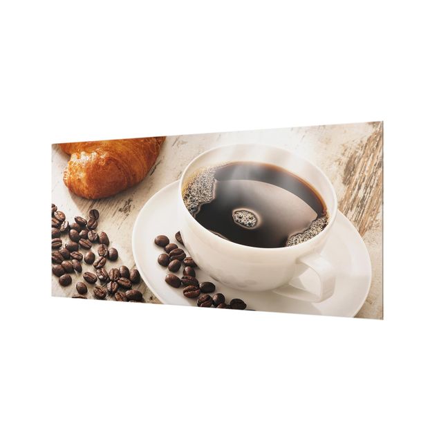 Wanddeko Fotografie Dampfende Kaffeetasse mit Kaffeebohnen