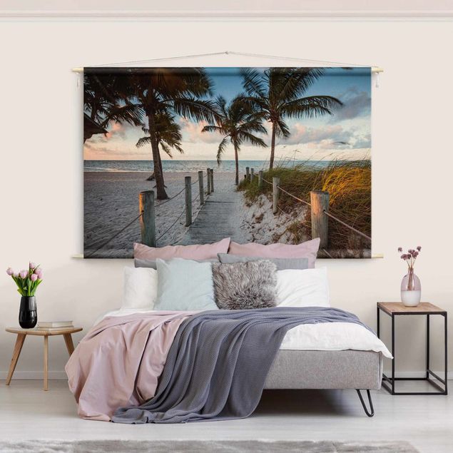 Wanddeko Wohnzimmer Palmen am Steg zum Meer