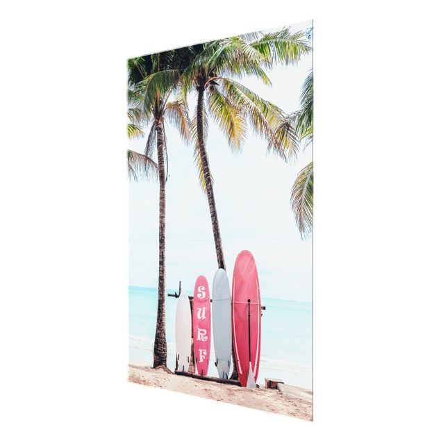 Wanddeko über Sofa Rosa Surfboards unter Palmen