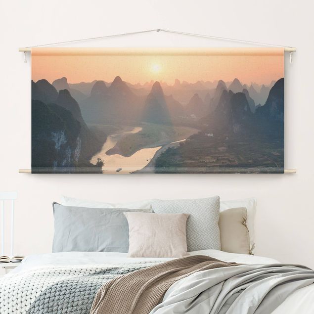 Wanddeko Wohnzimmer Sonnenaufgang in Berglandschaft